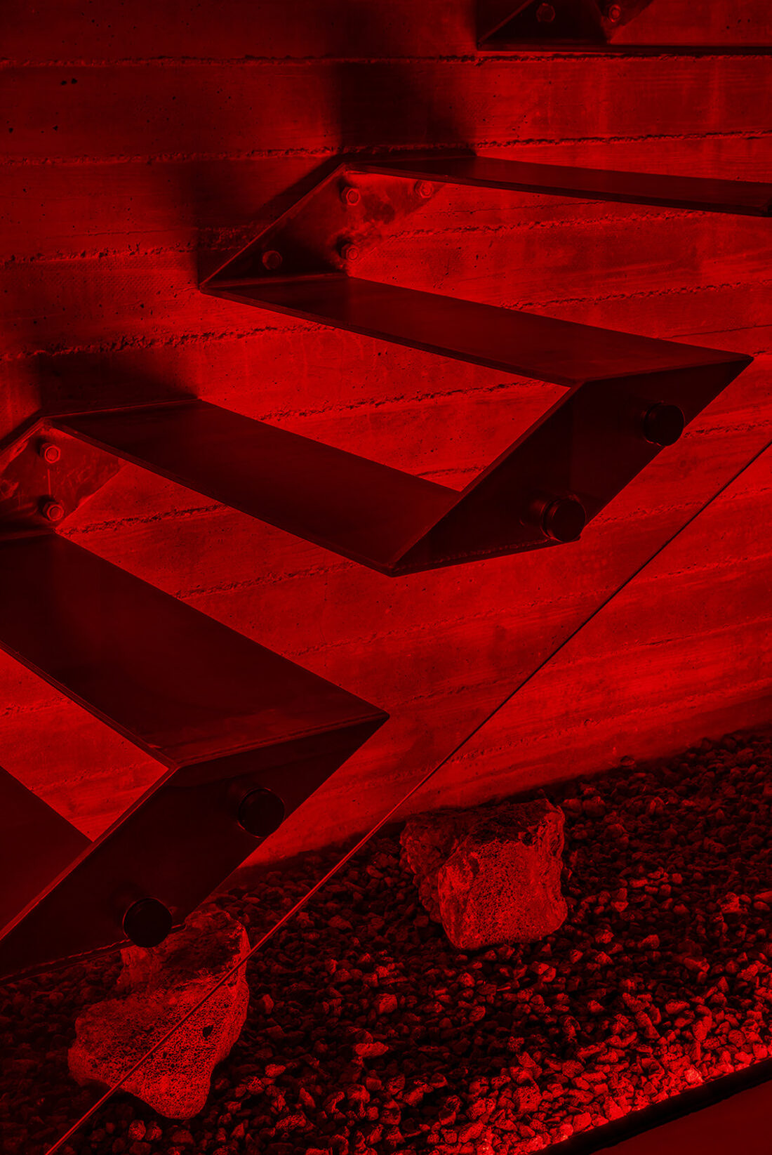 Floating stairs over lava rock, lit deep red by Twilight LEDs