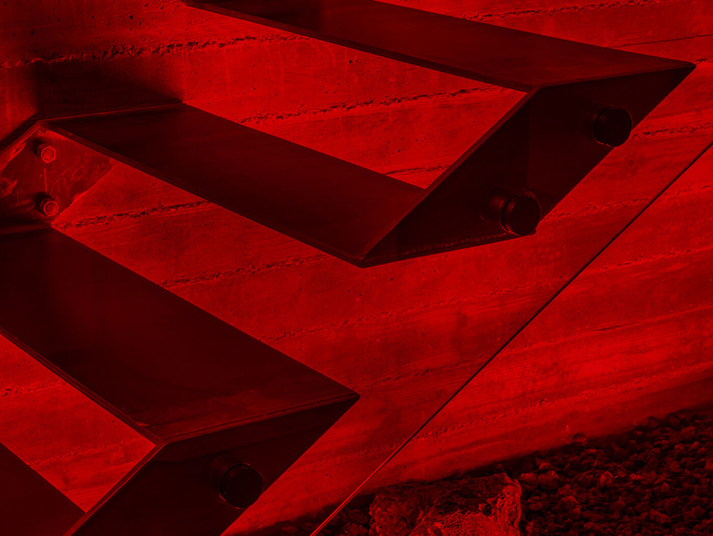 Project ALPICE: floating stairs and lava rock lit deep red