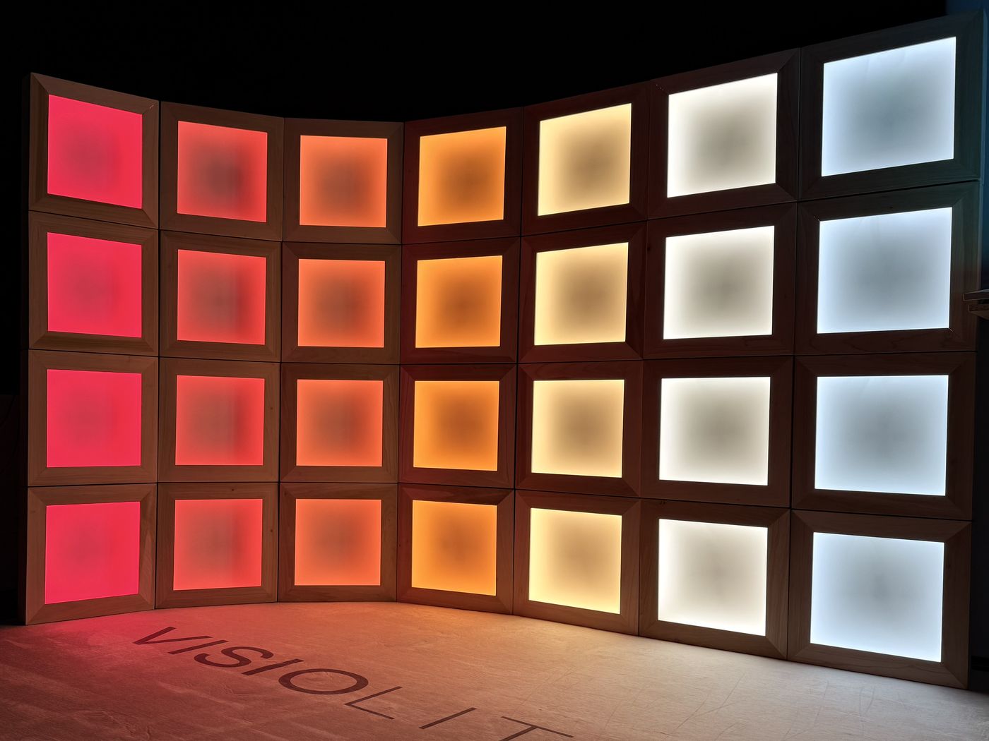 Celestial Echo Matrix: a wall of light boxes grading from deep red to cool white