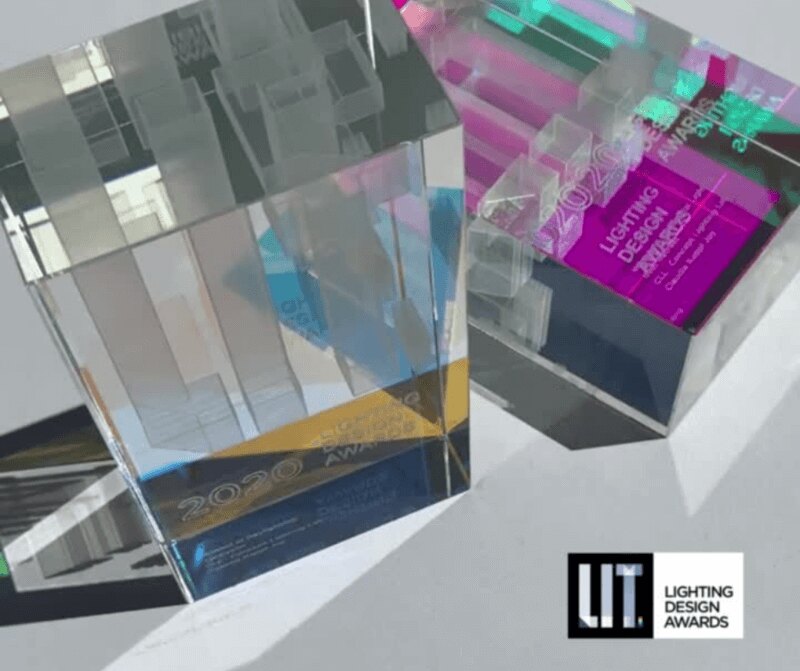 Glass LIT Lighting Design Awards trophies catching colored light
