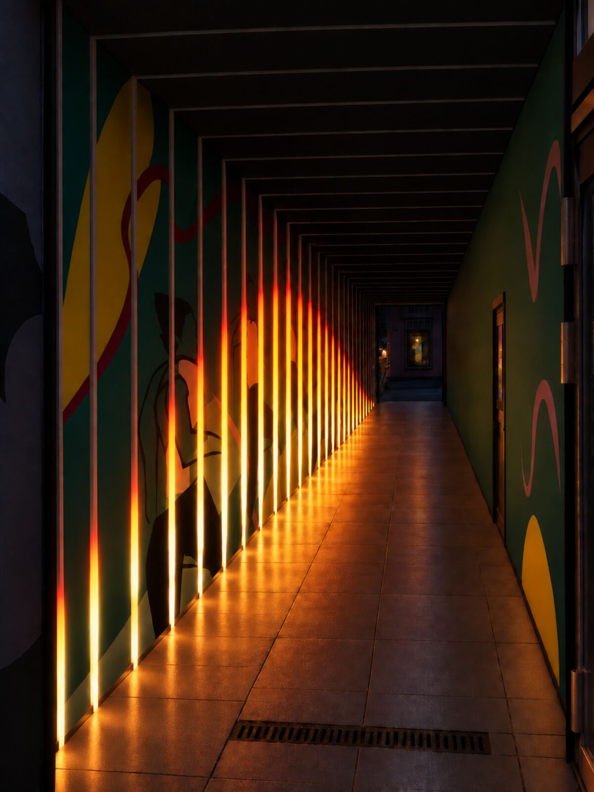 Tunnel concept: light frames along a pedestrian tunnel glowing deep red and orange at first light